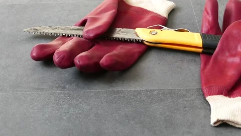 For work safety, it is necessary to work with gloves, there is a hand saw and 스톡 동영상 170624876