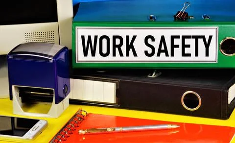 Work safety. Text label on the folder. Stock Photos
