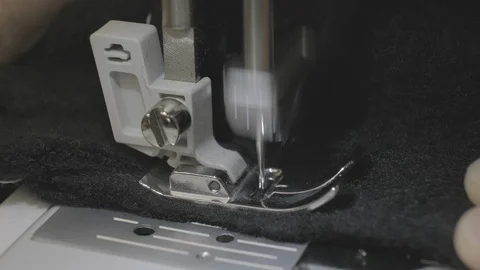 Work on the sewing machine. Slow motion Stock Footage 114623580