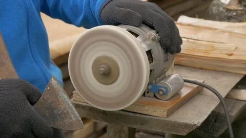 Work on a sharpening machine. Red sparks fly Stock Footage