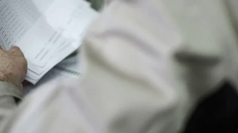 Work shop test taking notes in a notebook during the test of finished products Stock Footage 71506474