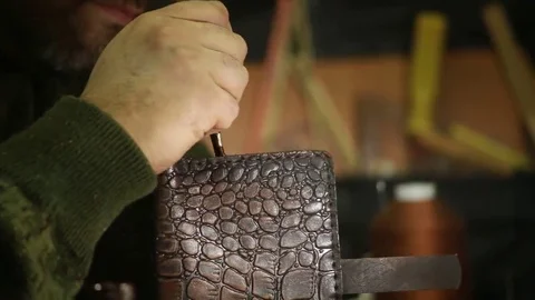 Work on skin, tailor, sewing, needle, purse Stock Footage 69088620