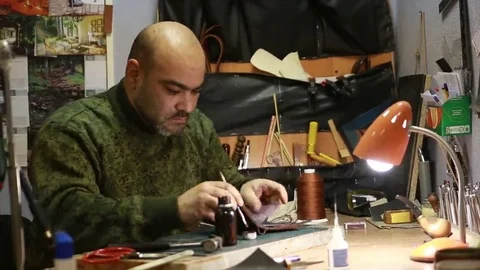 Work on skin, tailor, sewing, needle, purse Stock Footage 69088622