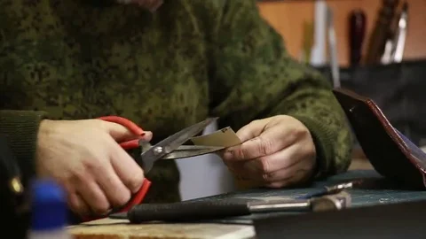 Work on skin, tailor, sewing, needle, purse Stock-Footage 69088626