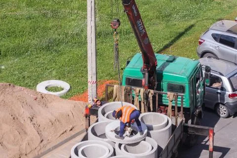 Work slinger during unloading. Stock Photos