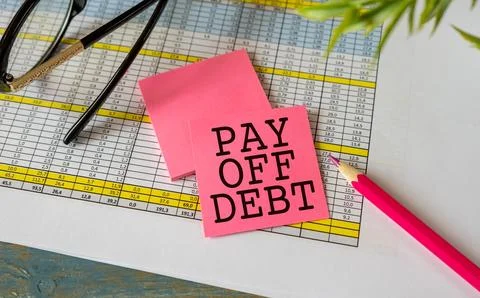Work smarter text Pay Off Debt on white sheet with pen, calculator and tables Stock Photos