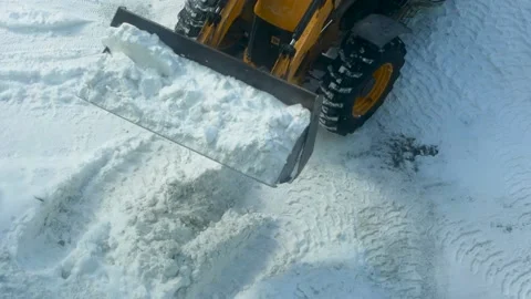 Work on snow removal from the local area with a snow Stock Footage 150623841