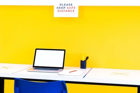 Work space adapted to the new normal. Working in the office with the computer Stock Photos