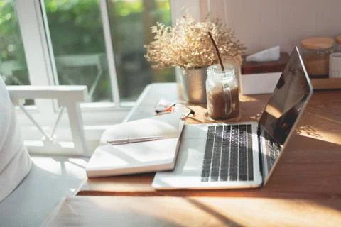 Work space, laptop and note book on the table in the cafe, copy space busines Stock Photos