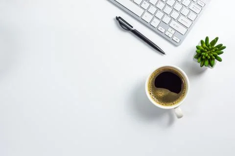 Work space on table with computer keyboard, pen, coffee cup and cactus pot, t Foto stock
