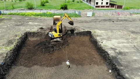 The work of special machines. The work of special vehicles. Tractor digs a pit. Stock Footage 111529631