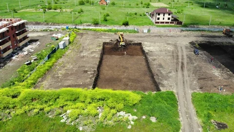 The work of special machines. The work of special vehicles. Tractor digs a pit. Stock Footage 111529654