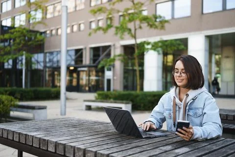 Work, spring and vanlife concept. Young smart and successful female programmer Stock Photos