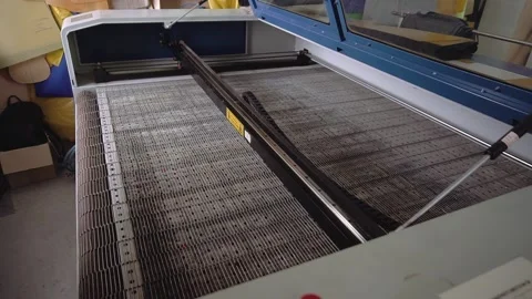 Work surface and rod with rubber strips on laser cutter tool Stock Footage 236907894