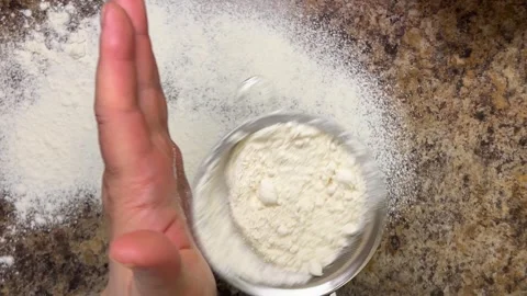 The work surface is sprinkled with a thin layer of flour for further work. Stock-Footage 321150613