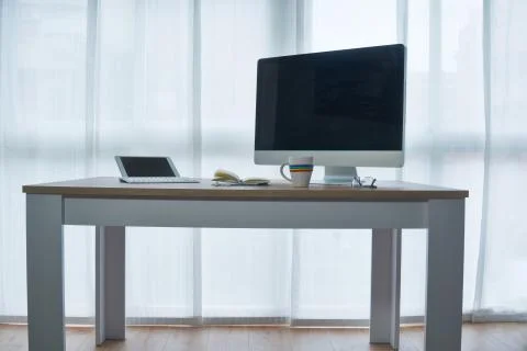 Work table from home. Necessary devices for teleworking. On the table there i Stock Photos