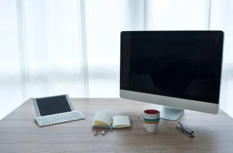 Work table from home. Necessary devices for teleworking. Stock Photos