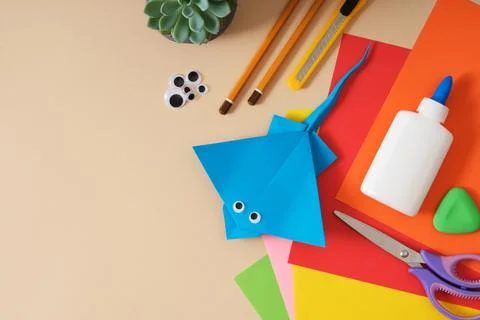 Work table for paper crafts colored sheets, glue, scissors, pencils, statio.. Stock Photos