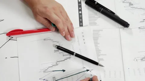 Work table with stock tables and stationery. Stock Footage 158594630