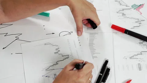 Work table with stock tables and stationery. Stock Footage 159417062