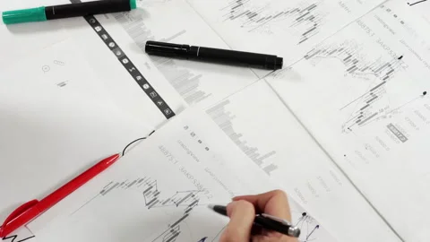 Work table with stock tables and stationery. Stock Footage 159417586