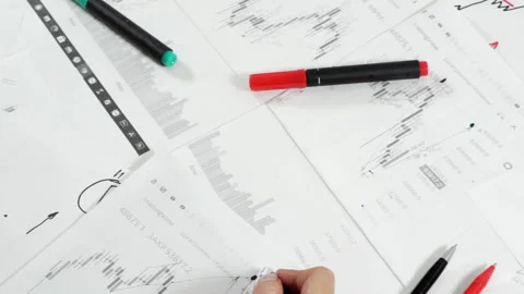 Work table with stock tables and stationery. Stock Footage 160899560