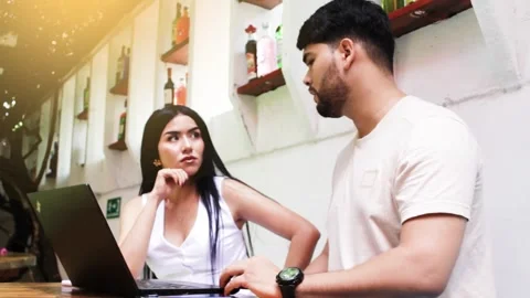 Work team discussing the creation of a project in a coworking space. Stock Footage 296409419