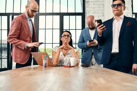 Work team trying to solve a difficult task Stock Photos