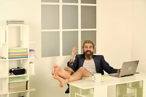 Work through evening or procrastinate further. Man doing business from home Stock Photos