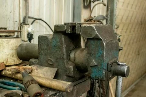 Work tool. Old heavy vice in the workshop. Stock Photos