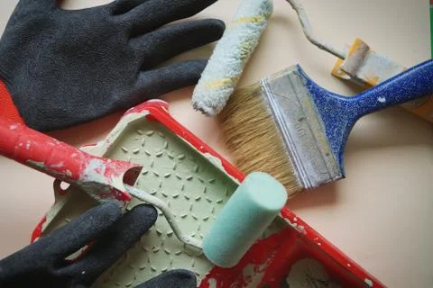 Work tool painter gloves roller paint brush repair flat house isolate Stock Photos