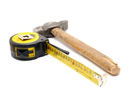 Work tool series: old tape measure and hammer Stock Photos