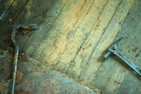 Work tools of a builder, a hammer and a crowbar. Stock Photos
