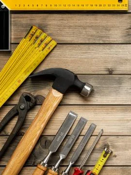 Work tools for carpenter on wooden background. Carpentry. Stock Photos