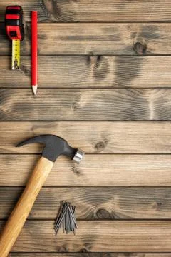 Work tools for carpenter on wooden background. Carpentry. Stock Photos
