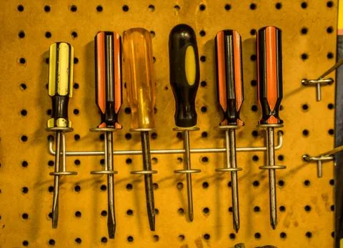 Work tools hang on the wall. Stock Photos