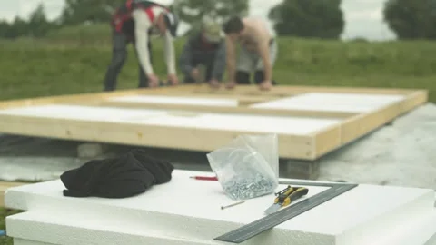 Work tools lying in the background of builders making new hen house on farm. Stock Footage 247517943