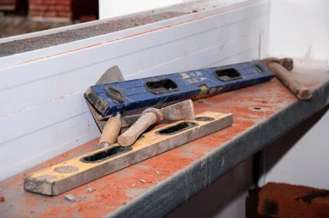 Work tools for masonry. Construction level, hammer, pickaxe, trowel. 스톡 사진
