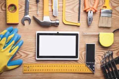 Work tools with tablet on wooden background. Empty screen for your text Stock Photos