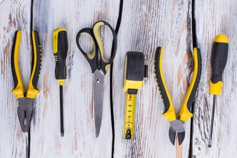 Work tools on wooden background. Stock Photos