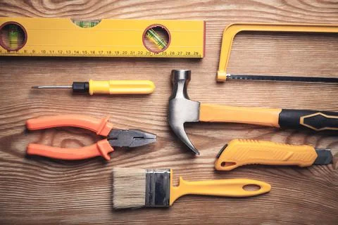 Work tools on wooden background. Stock Photos