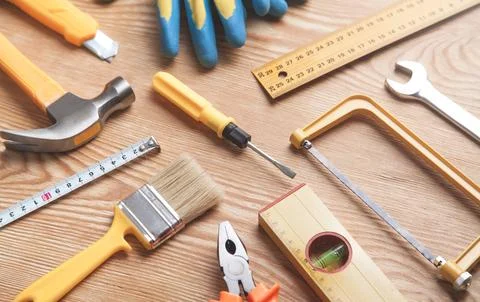 Work tools on wooden background. Stock Photos