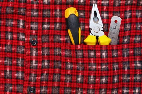 Work tools in work shirt pocket Foto stock