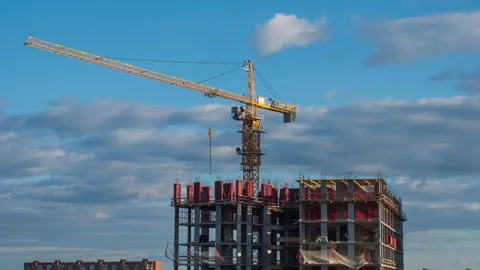 The work of a tower crane at a construction site. Stock Footage 293118350