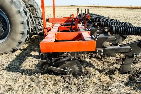 Work of the trailed unit for tillage in the field Stock Photos