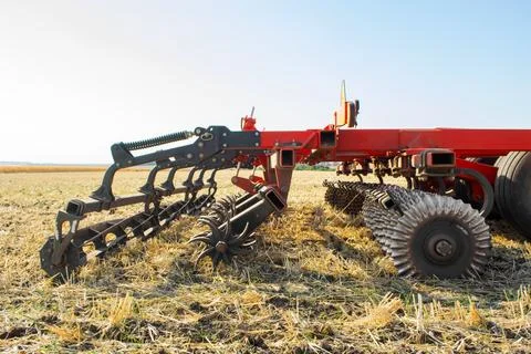 Work of the trailed unit for tillage in the field Stock Photos