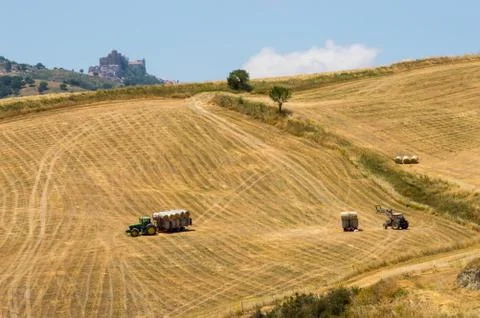 Work of two tractors in the fields in the north of Sicily with Stock Photos