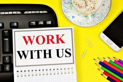 Work with us. Text label in the planning notebook. Stock Photos