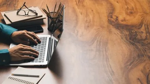 Work using laptop contact us at workplaces, planning ideas investors internet Stock Photos