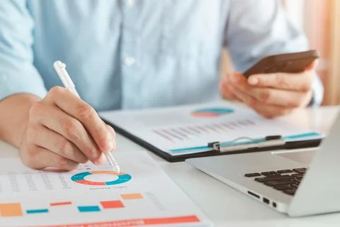 Work using mobile phone typing computer mobile chat laptop contact us at work Stock Photos